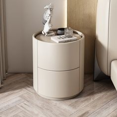 a white table with a book on it next to a chair