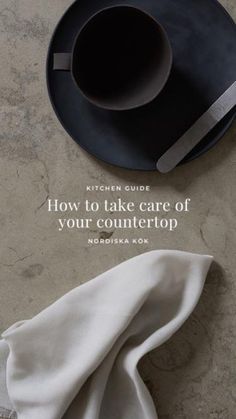 a black plate sitting on top of a table next to a white napkin