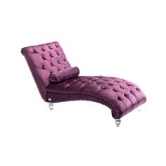 a purple chaise lounge chair sitting on top of a white floor next to a wall