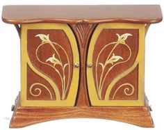 a small wooden cabinet with flowers painted on it