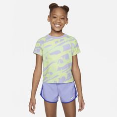 This colorful, Swooshtastic tee is sure to put some pep in your kiddo's step! It's made of cotton jersey, has a tagless crewneck for a comfy feel and the boxy cut creates a flattering, cropped look. Pair with the Nike Dri-FIT Prep in Your Step leggings for a coordinated style tailored for play. Multicolor Spring T-shirt For Playwear, Summer Athleisure T-shirt For Playwear, Playful Purple Summer T-shirt, Multicolor Sports T-shirt For Summer, Blue Moisture-wicking T-shirt For Spring, Sporty T-shirt For Summer Playtime, Multicolor Summer Sports T-shirt, Spring Blue Moisture-wicking T-shirt, Green T-shirt For Spring Playtime