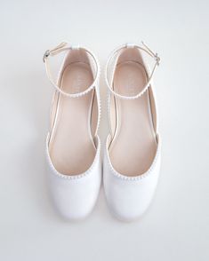 Inspired by a contemporary and refined ballet style flat. Classic silky satin round toe flat with added mini pearls details brings an elevated elegance. The delicate mini pearl beads are placed carefully by hand to create a graceful classic bridal shoe. Perfect for fall or summer wedding, evening wear, holiday, or romantic date.DETAILS:UPPER: Synthetic upper and liningMATERIALS: Manmade outsoleImported Materials White Shoes Flat, Wedding Dress And Flats, Pearl Ballet Flats, Wedding Dress Flats, Prom Shoes Flat, Bridal Flats Shoes, Flat Wedding Shoes For Bride, Bride Shoes Flats, Wedding Flat Shoes