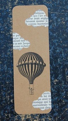 a piece of paper with an image of a hot air balloon on it's side