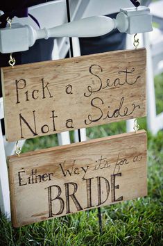 two wooden signs that say pick a seat not a side, either way it's for the bride and groom