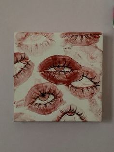 an art piece with red and pink lips on it