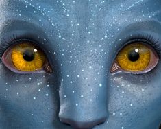 an avatar with yellow eyes and blue skin