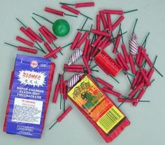 a bunch of red and green toothpicks next to a bag of candy canes