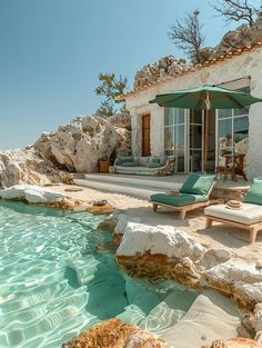 an outdoor swimming pool with chaise lounge chairs