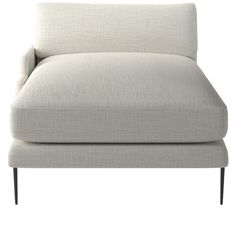 a white couch with black legs and a light colored upholstered backrests