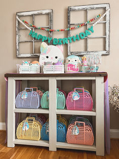 a shelf with baskets and toys on it