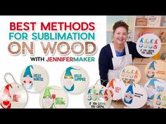 a woman standing in front of a table filled with wooden signs and magnets that say best method for sublimation on wood