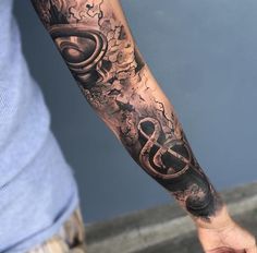 a man with a tattoo on his arm