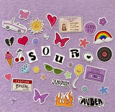 the word sour surrounded by various stickers on a purple t - shirt that says sour