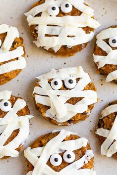 some cookies with icing and eyes on them