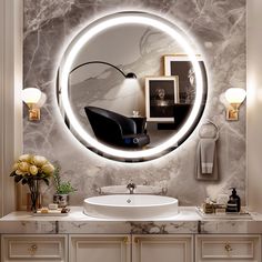 a bathroom with a round mirror on the wall