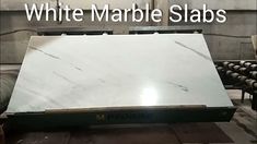 white marble slabs are stacked on top of each other