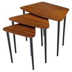 three wooden tables sitting next to each other