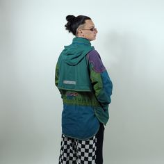 A gorgeous vintage piece from Adidas, a Adidas Adventure jacket with details that can be rarely seen on any type of garment. Irregular stitches, pockets and shapes, along a vibrant vintage color palette and the most mind blowing details, the chameleon hidden in the spellout embroidery. Size and fit: * Size S on tag. * Fit: S-M (varies by body shape, check the measurements in the last picture to be 100% sure it fits you.) * Model:  172cm (5'8"), 65kg (143 pounds), skinny body type. Details: * Fab Vintage Colour Palette, 90s Adidas, Bleu Violet, Adidas Blue, Green Top, Jacket Vintage, Blue Adidas, Purple Green, Vintage Colors