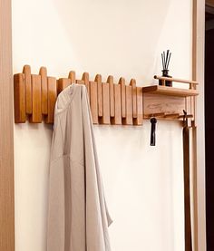 a coat rack with umbrellas hanging on it