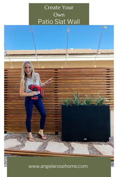 a woman standing in front of a wooden fence with text overlay that reads create your own patio sit wall