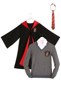 two children's harry potter sweaters and a tie on top of each other