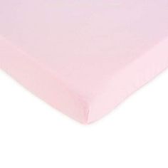 a pink sheet that is on top of a bed