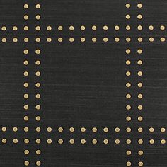 a black rug with gold dots on it