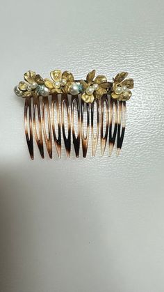 This is a Vintage 1930's MIRIAM HASKELL Hair Clip Victorian Floral Faux Pearls Plastic Brooch in Great Condition for its Age. Please See Photos for Additional Information. Please Don't Hesitate to Ask Any Questions You Might Have!?? Thanks For Looking and Don't Miss Out (Display Not Included) Miriam Haskell Clip On Earrings, Vintage Gold Flower Clip-on Earrings, Vintage Gold Pearl Clip-on Earrings, Vintage Pearl Clip-on Earrings For Gift, Victorian Gold Metal Brooches, Miriam Haskell, Barrettes, Faux Pearl, Aura