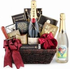 a bottle of wine and some chocolates in a basket