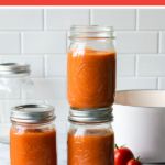 three jars filled with food sitting on top of a table