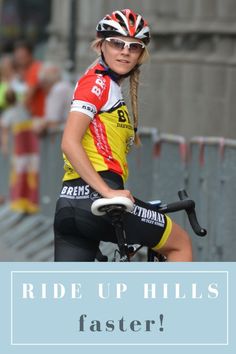 a woman riding a bike with the words ride up hills faster