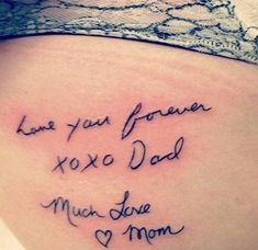 the back of a woman's stomach with writing on it that says, i love you