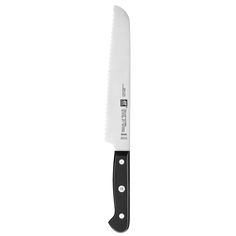 a large knife with a black handle on a white background