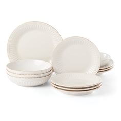 a set of white dinnerware on a white background