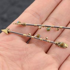 Burnished Gold Industrial Barbell Arrow with Stone Industrial Rings Body Piercing Jewelry Style of Industrial Piercing:1PC Arrow Industrial Barbell Rings Piercing Barbell. Gauge of Industrial Barbell:Bar Thickness:14 Gauge (1.6mm) ;Bar Length:38mm. Material of Industrial Ring: 316L Stainless Steel,Lead ,Nickel Free, Healthy for Sensitive Skin. Vintage Arrow Design,Durable & Fashionable,Give You More Charming Look! High Polished Smooth Surface,Safety and Comfortable for Different Daily Outfit Industrial Piercing Jewelry Unique, Scaffold Piercing Industrial Bars, Industrial Piercing Dangly, Industrial Bar Jewelry, Bar Peircings Cute, Pretty Industrial Piercing Jewelry, Arrow Industrial Piercing, Gold Industrial Piercing Bar, Unique Industrial Piercing Jewelry