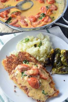 there is a plate with some food on it and a pot of soup in the background