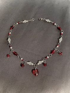 🤍🩸Gothic bleeding hearts necklace, my twist on the viral bleeding pearl necklace handmade with costume jewelry faux pearls, glass heart beads, and stainless steel to ensure you're jewelry is strong, won't rust and won't turn your neck green! Hypoallergenic as well for sensitive skin people who want to wear jewelry without discomfort.   Goth and horror with a touch of elegance. Perfect for vampires. Tired of Halloween Items that can only be used once a year? This piece can go well with any aesthetic and or style! You can wear it everyday and it will be great for not just Halloween but Valentine's Day too. Makes for a perfect gift for your significant other or loved one. And of course yourself because the best love is self love :) 🤍 Out of stock? Follow my store to stay updated when I res Goth Jewelry Diy, Blood Jewelry, Vampire Choker, Pearl Necklace Handmade, Vampire Necklace, Vampire Jewelry, Jewelry Goth, Grunge Accessories, Diy Jewelry Unique