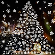 a christmas tree with white snowflakes on it in front of a black background