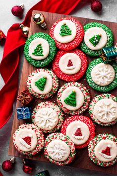 decorated christmas cookies on a wooden board