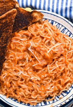 a plate with noodles and toast on it