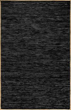 an area rug with black and tan trim