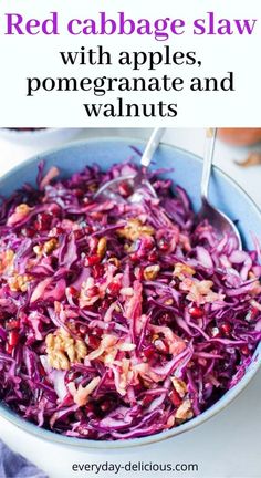 red cabbage slaw with apples, pomegranate and walnuts in a bowl