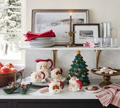 a kitchen counter topped with lots of christmas decorations