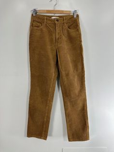 PacSun classic "Mom Jean" in camel-colored wide wale corduroy. Very good condition. Zipper fly. 5 pockets.  Label: PacSun Labeled size: 24 Fabric content: 100% cotton Care instructions: Machine wash Waist: 26" Hips: 36" Rise: 10" Inseam: 28" Overall length down side seam: 38" Leg opening measured laying flat: 6" Vintage Straight Leg Corduroy Jeans, Levi's Straight Leg Corduroy Pants, Retro Full-length Corduroy Pants, Straight-leg Corduroy Pants With Hip Pockets, Brown Mid-rise Corduroy Pants, Wide Wale Corduroy, Mom Jean, Jeans Mom, Camel Color