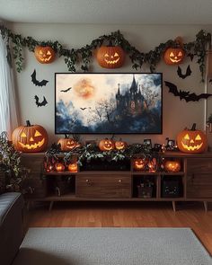 a living room decorated for halloween with pumpkins