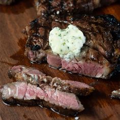 the steak has been sliced and is ready to be served with mashed potatoes on it