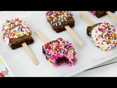 chocolate covered ice cream pops with sprinkles on them