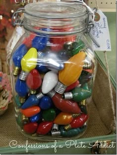 a glass jar filled with lots of colorful lights