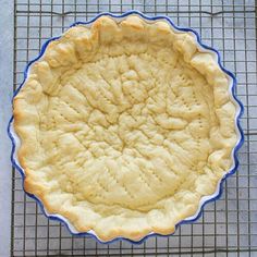 an uncooked pie crust on a cooling rack