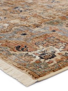 an area rug with many different colors and patterns on it, including brown, blue, beige